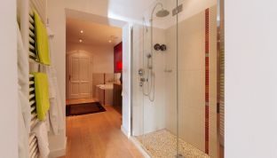 Dusche der Red Suite Design Suite im Boutiquehotel Cortisen am Wolfgangsee mit modernem Design, klaren Linien und hochwertiger Ausstattung