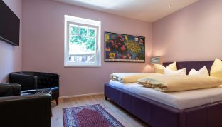 Bett im Doppelzimmer Standard im Boutique Hotel Cortisen
